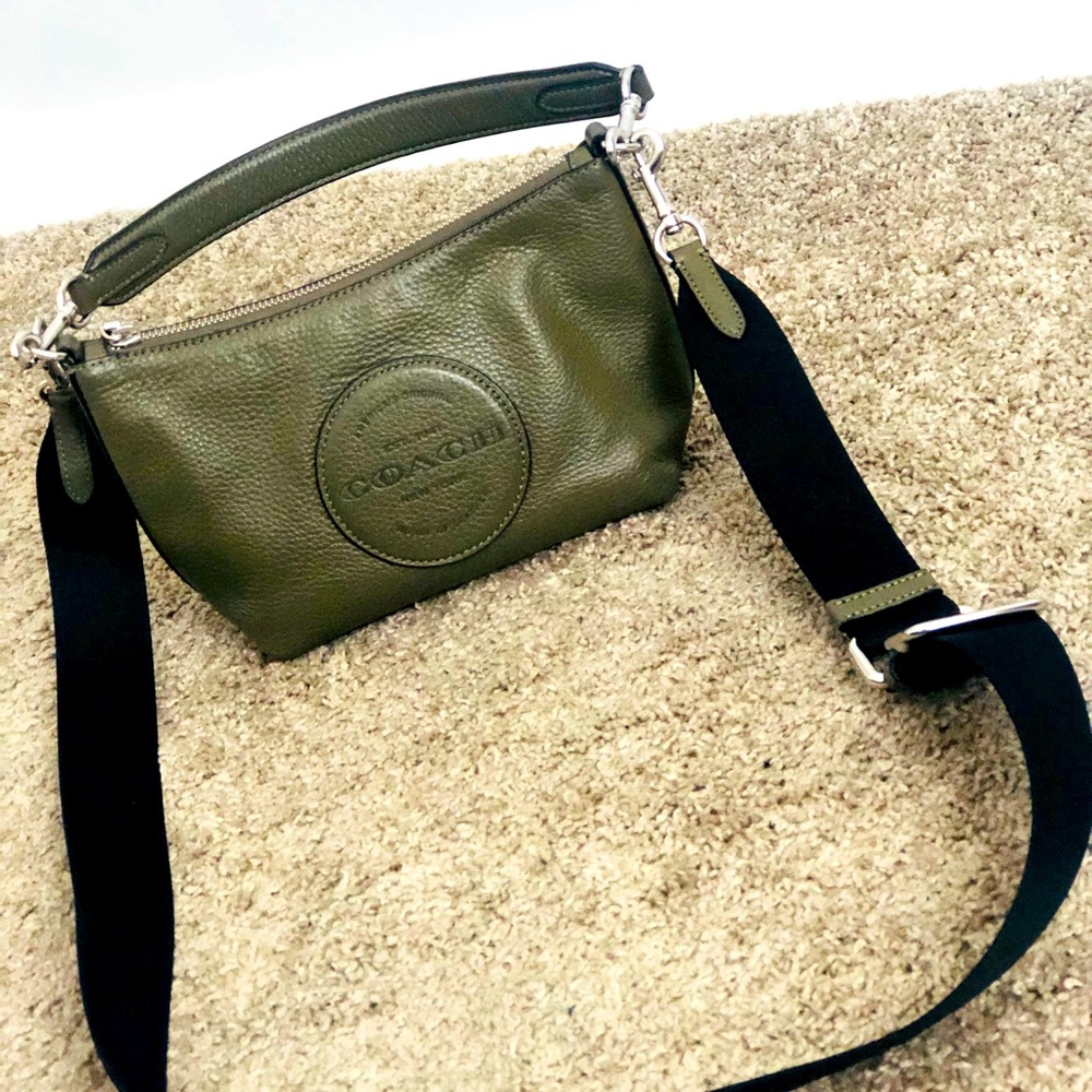 A warm green colour coach bag styled to go with every outfit.